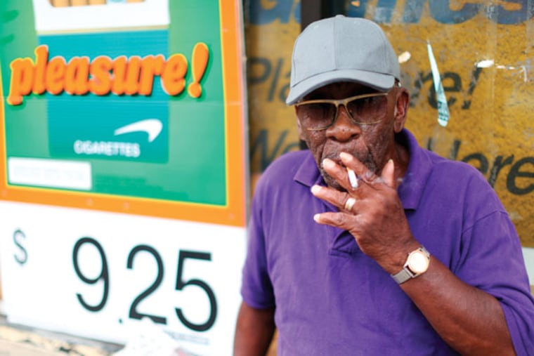 James W. Mitchell smokes at 40th and Market Street Wednesday. (DAVID SWANSON / Staff Photographer)