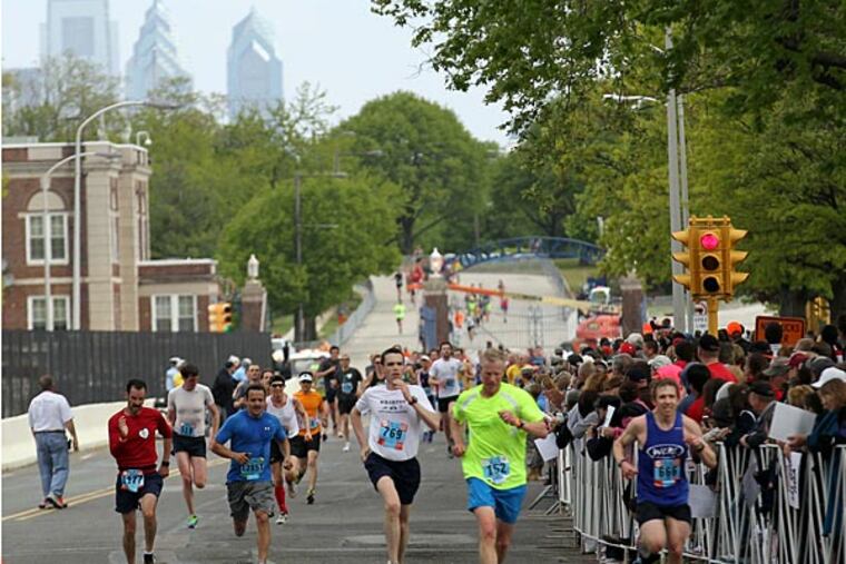 Runners enter the Navy Yard as they wrap up the 2013 Broad Street Run.