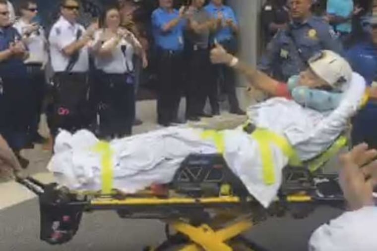Officer Josh Vadell gives a thumbs-up as he is released from the hospital on Thursday, Sept. 15, 2016. Vadell was shot in the head as he responded to a robbery outside a casino Sept. 3.