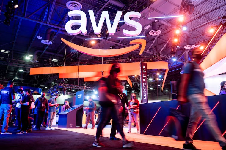 Attendees walk through an expo hall at AWS re:Invent 2021, a conference hosted by Amazon Web Services (AWS) on Dec 1 in Las Vegas. The service was down for at least six hours Tuesday in parts of the east coast.