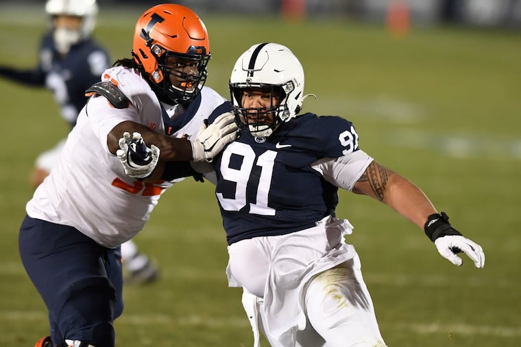 Penn State defensive tackle Dvon Ellies (91) fighting off a block by Illinois offensive lineman Verdis Brown last December.