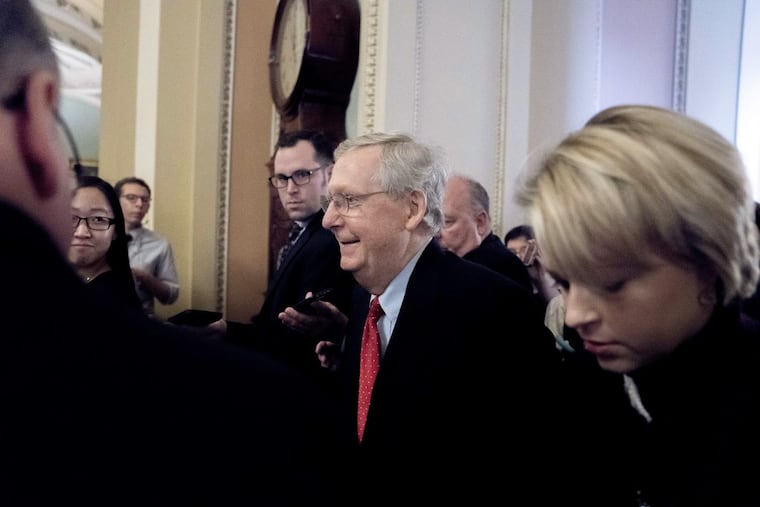 Majority Leader Mitch McConnell hours before the Senate passed sweeping tax reform with no Democratic votes early Saturday morning. (AP Photo/Andrew Harnik)