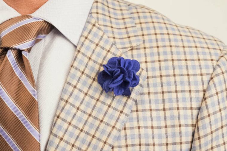 A new take on the boutonniere, floral lapel pins, as well as pocket squares, are making a comeback.