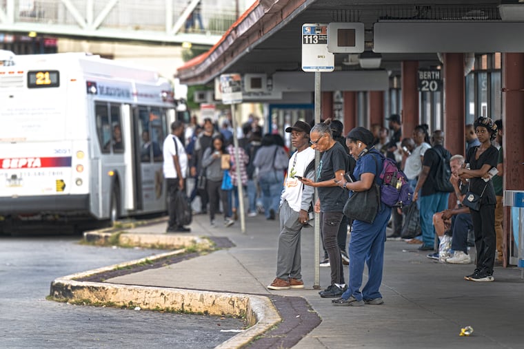 Commuters wait to board a SEPTA bus during the early morning hours at the 69th Street bus station in Upper Darby on Monday, Aug. 25, 2025. It is the second day of SEPTA’s initial phase of service cuts, which began Sunday with the elimination of 32 bus routes and reductions in rail service.