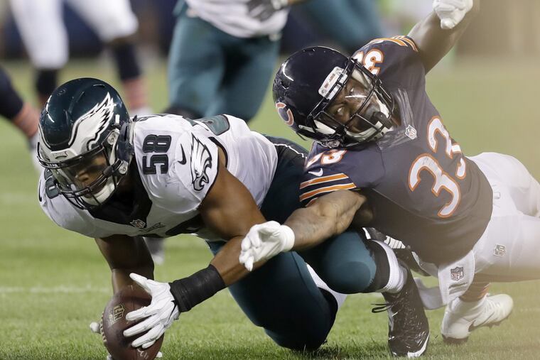 Eagles' inside linebacker Jordan Hicks recovers a third-quarter fumble against Chicago Bears' cornerback Deiondre' Hall on Monday, September 19, 2016 in Chicago. YONG KIM / Staff Photographer