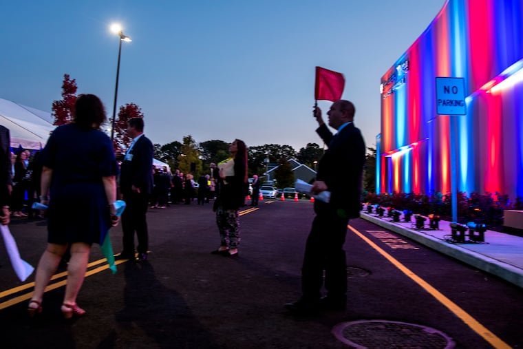 October 17, 2022: During a VIP Preview, a guide holds a flag to lead tours of Penn Medicine/Virtua Health's new $45 million Proton Therapy cancer center. South Jersey’s first, and one of only about 50 such facilities in the country.