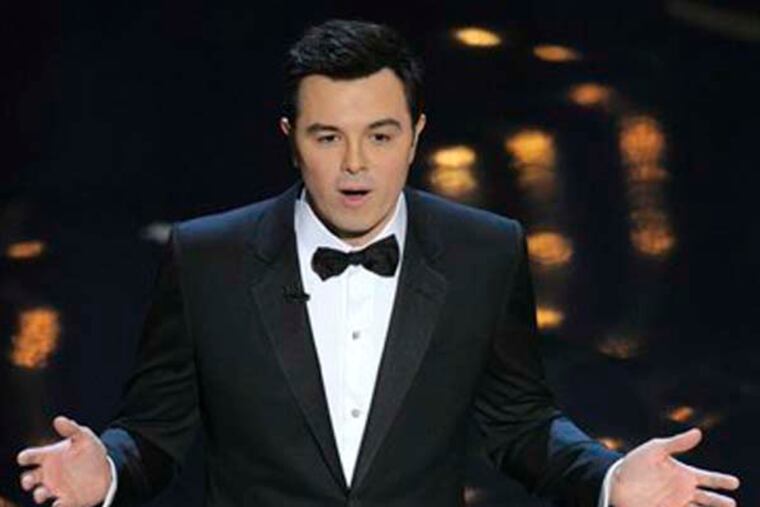 Host Seth MacFarlane speaks onstage during the Oscars at the Dolby Theatre on Sunday Feb. 24, 2013, in Los Angeles. (Photo by Chris Pizzello/Invision/AP)
