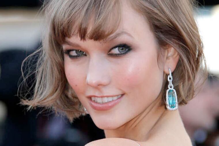 Model Karlie Kloss' nape-of-the-neck shag with a bit of bang boosted the look. (AP Photo)