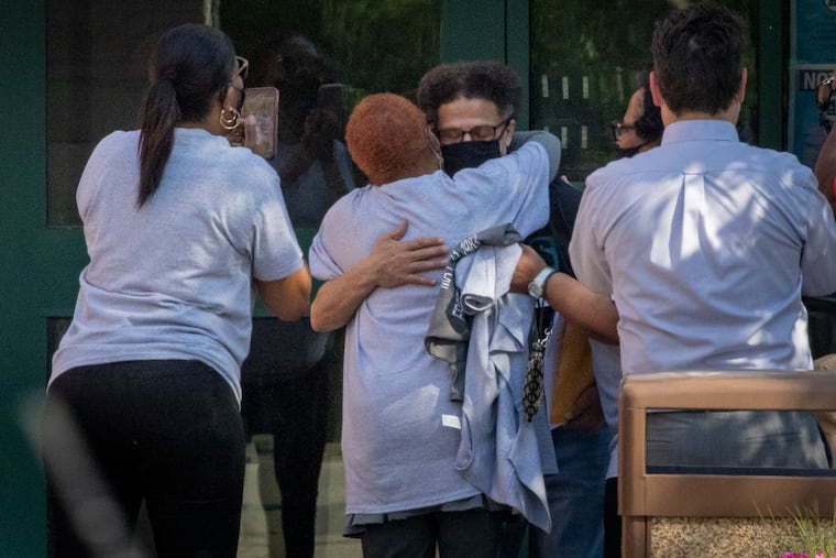 Larry Walker is hugged by family as he leaves the State Correctional Institution Chester after serving 38 years on Friday afternoon May 21, 2021. His conviction was overturned.