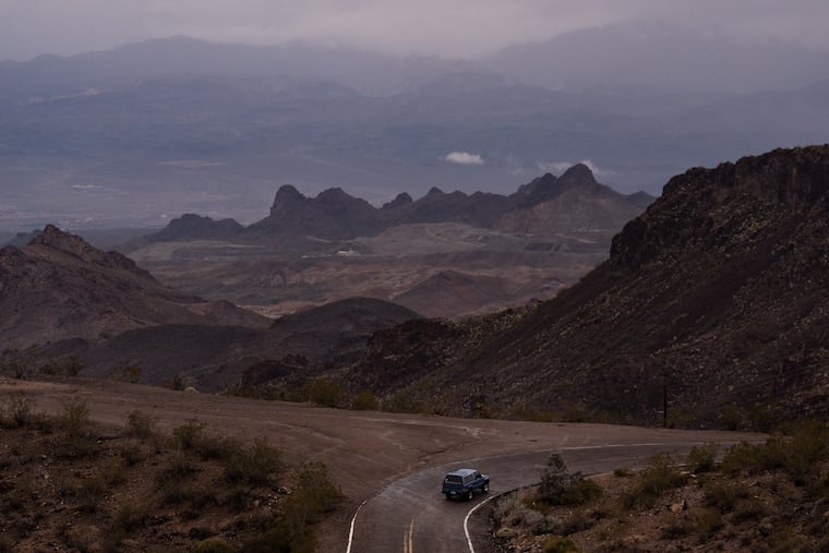 A car is driven along Oatman Highway, historic Route 66, near Oatman, Ariz., Friday, Nov. 21, 2025.