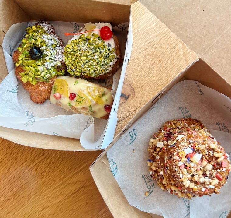 A quartet of Italian pastries at June 6 pop-up at Suraya featuring chef Joey Baldino. From left: pistachio cornetto, ricotta zeppole, lemon-semolina cake, and a pignoli brioche