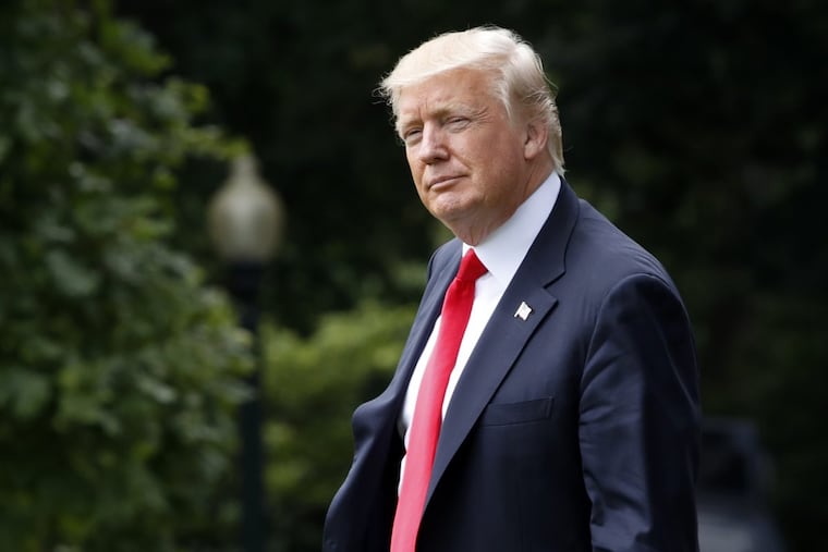 President Trump, who is still calling for a travel ban, prepares to board the Marine One helicopter at the White House Wednesday.