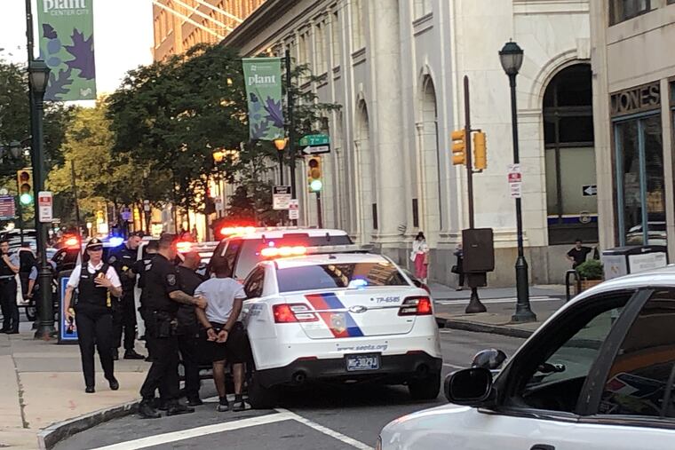 Philadelphia and Septa police responded Sunday evening, July 28, 2019, to a report of two males who attempted to hold up a man in the concourse at 8th and Market Streets. Police chased the suspects and are seen here arresting one of them at 7th and Chestnut.