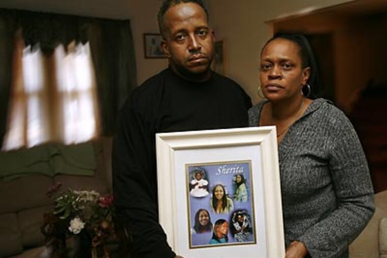 “This is a bittersweet time for us,” says Wilma Williams (right), at home in Pennsauken with husband Harry and images of their daughter Sherita, who was found slain at 16. (Eric Mencher/Staff Photographer)