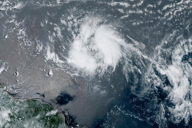 This GeoColor satellite image taken Tuesday and provided by NOAA shows Tropical Storm Bret as it chugged toward the eastern Caribbean.
