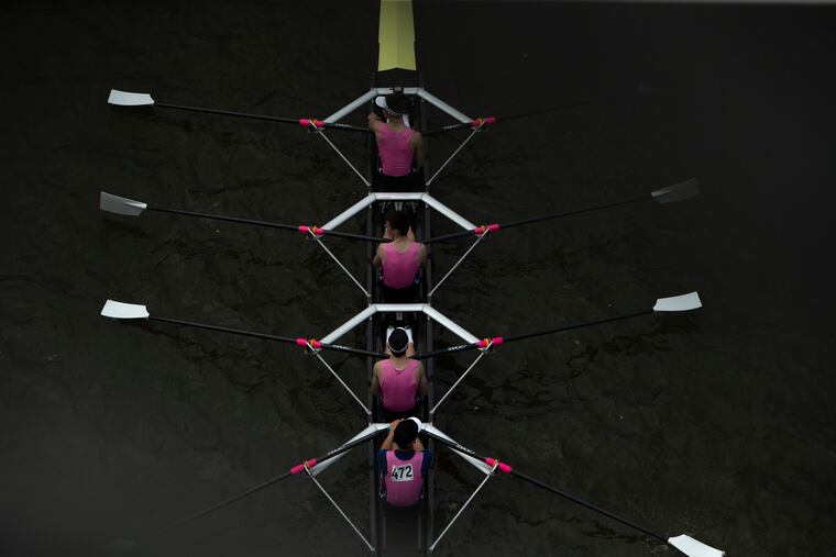 Rowers from Malvern Prep make their way down the Schuylkill on Friday at the Stotesbury Cup Regatta.