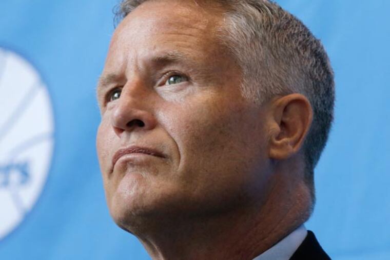 76ers incoming head coach Brett Brown listens to a reporters question at a news conference, Wednesday, Aug. 14, 2013, in Philadelphia. Brown's hire ended a four-month search to replace Doug Collins. (Matt Rourke/AP)