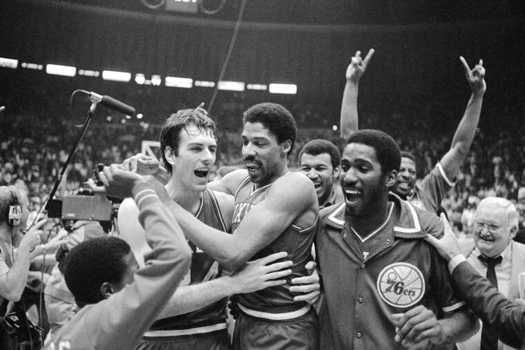 Philadelphia 76ers Bobby Jones, left, embraces Julius Erving after the 76ers defeated the Los Angeles Lakers in four straight games to win the NBA Championship in 1983.