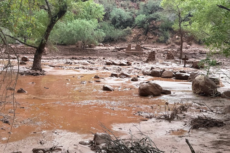 This photo provided by the National Park Service shows remnants of stone bridge pylons along Bright Angel Creek in the Grand Canyon following a flash flood that destroyed the footbridge Saturday.