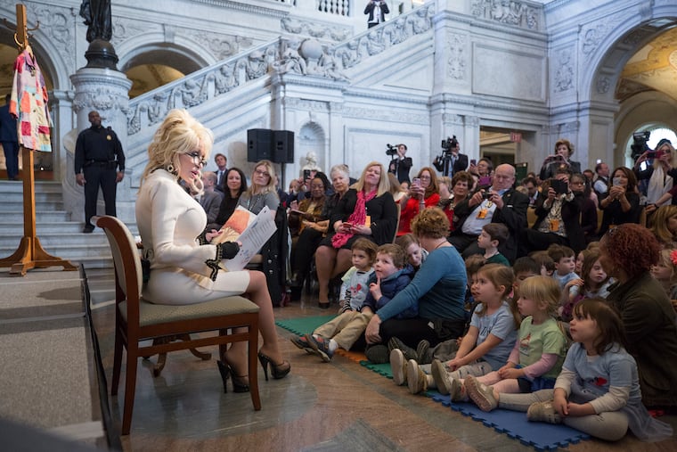 Dolly Parton reading to children at the Library of Congress in 2018.