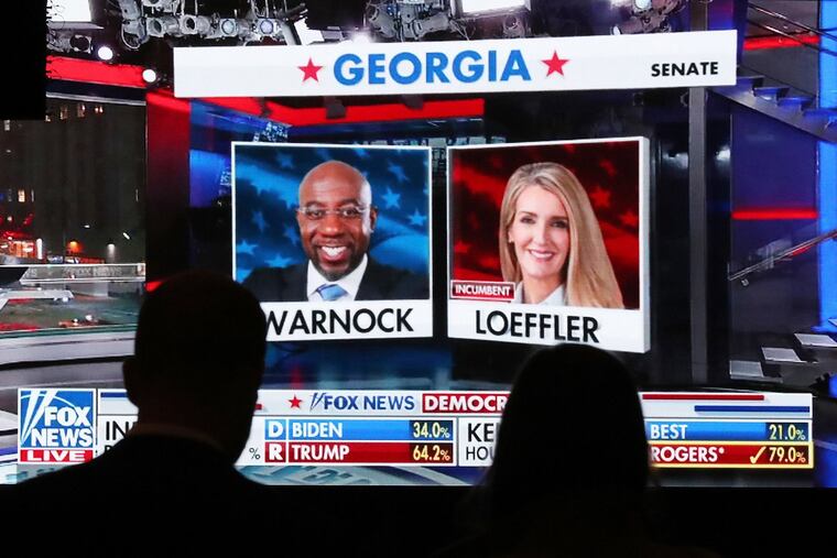 Republican supporters watch returns for Democratic U.S. Senate candidate Raphael Warnock and Republican incumbent Kelly Loeffler come in at the Georgia Republican Party Election Night Celebration Party at the Intercontinental Buckhead Atlanta hotel on Tuesday, Nov. 3, 2020, in Atlanta.