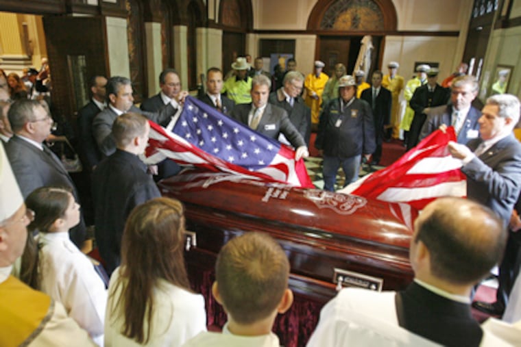A flag is draped over Sgt. Stephen Liczbinski’s casket. “Killed in the line of duty — those are the six words we never hope to hear,” said Commissioner Charles Ramsey. (Michael S. Wirtz / Inquirer)