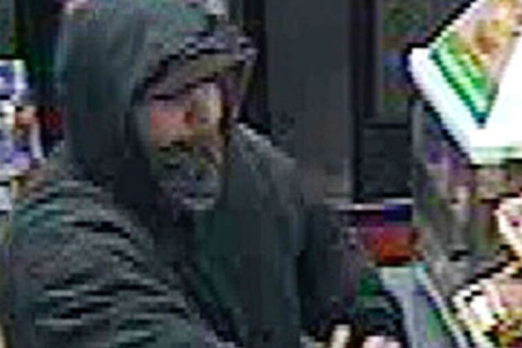 Alleged serial robber stealing from a 7-Eleven in the Northeast, caught in a video. He stole $200 from the store on Rising Sun Ave.