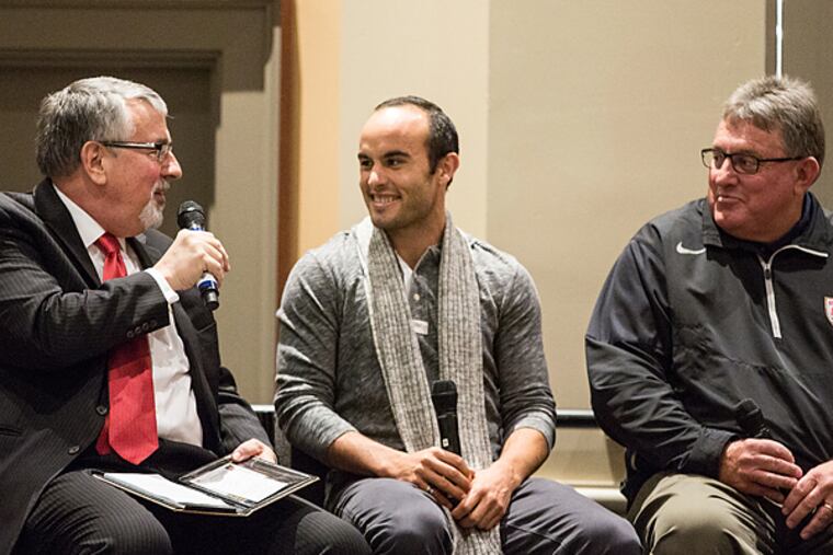 National Soccer Coaches Association of America CEO Joe Cummings (left) chats with Landon Donovan (center) and former U.S. under-17 boys' national team coach John Ellinger (right) during a seminar on Friday at the Convention Center. (Colin Kerrigan/Philly.com)