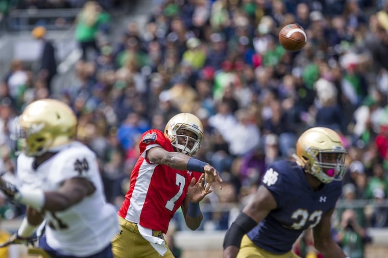 Notre Dame’s new starting quarterback, Brandon Wimbush, center, throws during the Notre Dame spring football Blue-Gold game on Saturday, April 22, 2017.