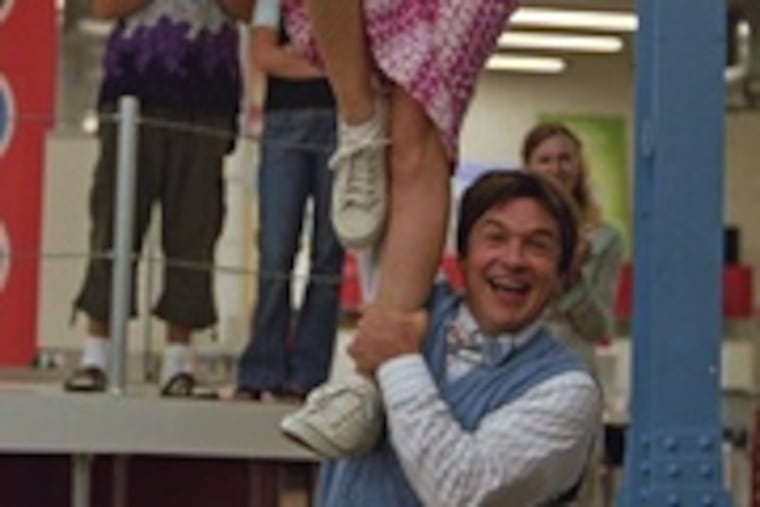 The man in the wheelchair, Jason Bateman, is the ex, working to win back Amanda Peet's affections.