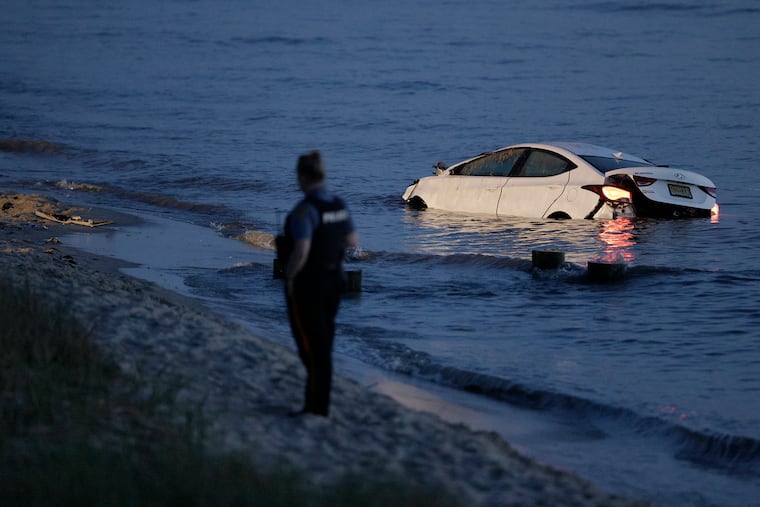 A car came to a stop in the Delaware Bay just before 8 p.m. Sunday in North Cape May, N.J. after it lost control and fatally injured a woman on a bench overlooking the water.
