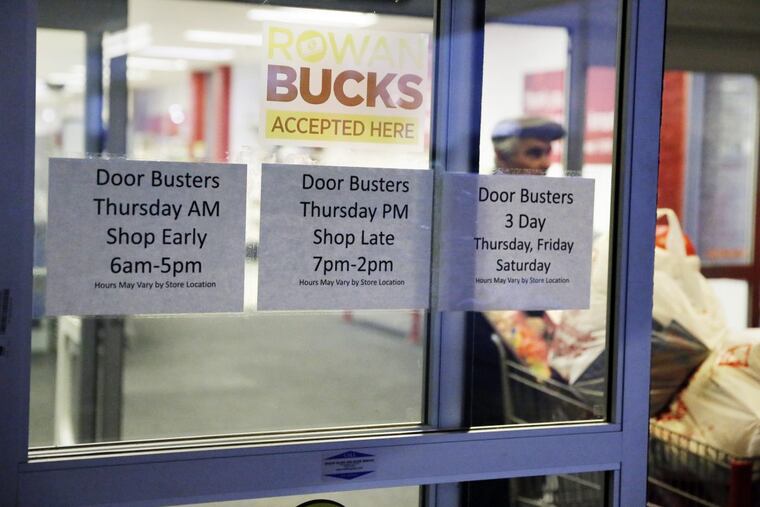 At shopper leaves Kmart in Glassboro with a shopping cart full of bags at 7am on Thanksgiving morning last year.