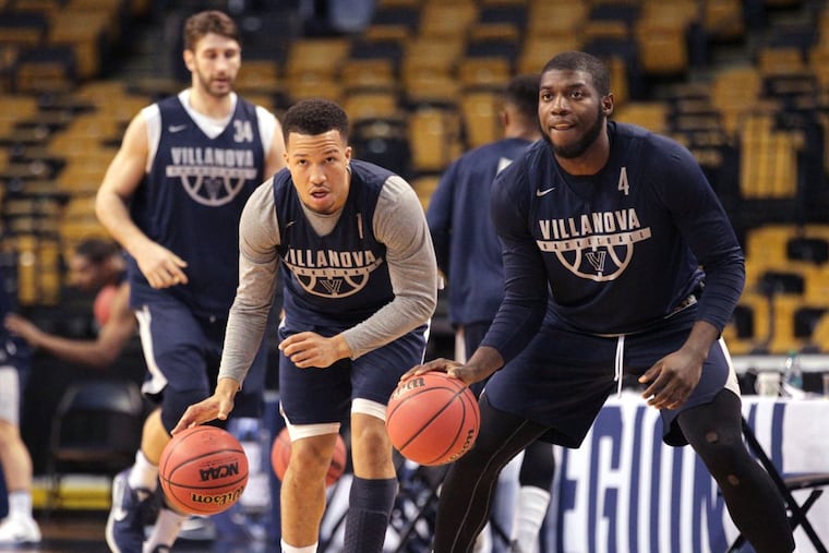 Jalen Brunson, center, of Villanova and Eric Paschall, right, during their practice session in TD Garden on March 22, 2018. They will face West Virginia in the round of 16 in the NCAA Tournament.