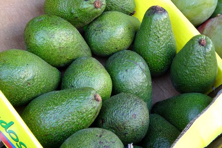 A truck carrying boxes of Avocado's made guacamole of the morning rush hour when it overturned Friday at the foot of the Ben Franklin Bridge in Center City.