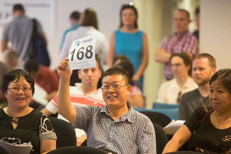 The auction of city-owned lots attracted 93 bidders and brought in nearly twice the $1 million hoped for by its organizer, City Councilman Mark Squilla. (ED HILLE / Staff Photographer)