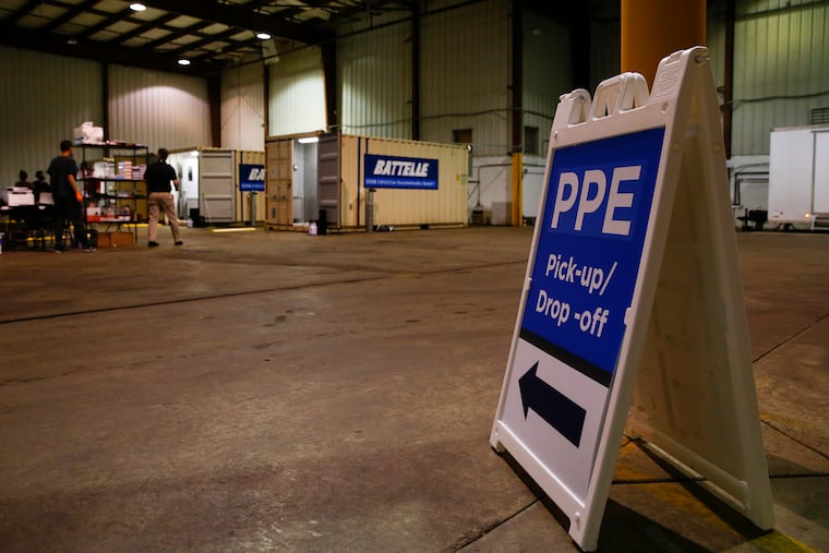 A sign indicating PPE pick-up and drop-off at a warehouse in Glen Mills, Delaware County on Friday, May 1, 2020. Battelle was awarded a contract by the U.S Department of Health and Human Services (HHS) and the Federal Emergency Management Agency (FEMA) to provide N95 decontamination at no charge.