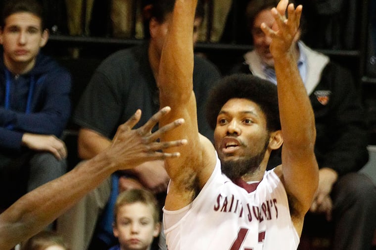 DeAndre' Bembry shoots against Princeton.