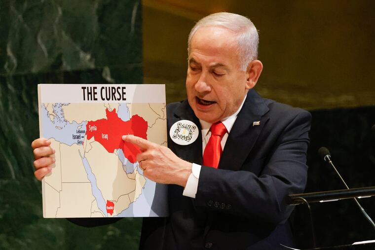 Israeli Prime Minister Benjamin Netanyahu holds up a map while speaking at the 80th session of the United Nations General Assembly on Friday, Sept. 26.