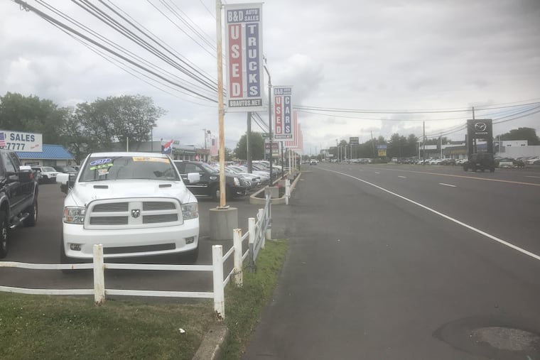 A used-vehicle dealership on Lincoln Highway in Lower Bucks. The county commissioners passed Pennsylvania's first county-level used-car lemon law in June.