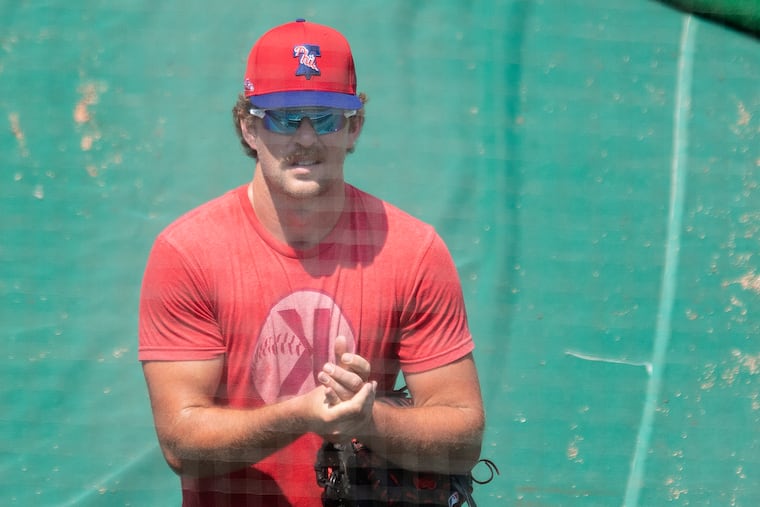 Phillies first baseman Rhys Hoskins sanitizes his hands at the end of a training-camp workout at Citizens Bank Park.