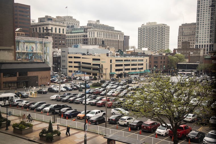 Cars and SUVs fill a parking lot at Eighth and Market Streets in Philadelphia. Nationwide, there are an estimated eight parking spaces for every vehicle.