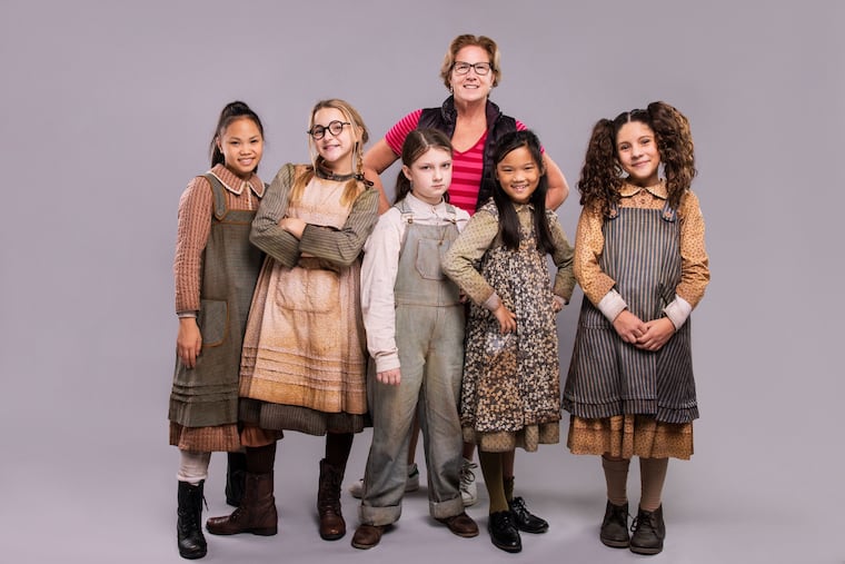 The orphans and their tutor in the Annie national touring company. (L to R) Kenzie Rees, Vivianne Neely, Riglee Ruth Bryson, Eileen Loveless (tutor), Bronte Harrison, and Valeria Velasco.