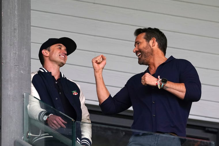 Wrexham co-owners Rob McElhenney (left) and Ryan Reynolds (right) in the stands during Saturday's game.