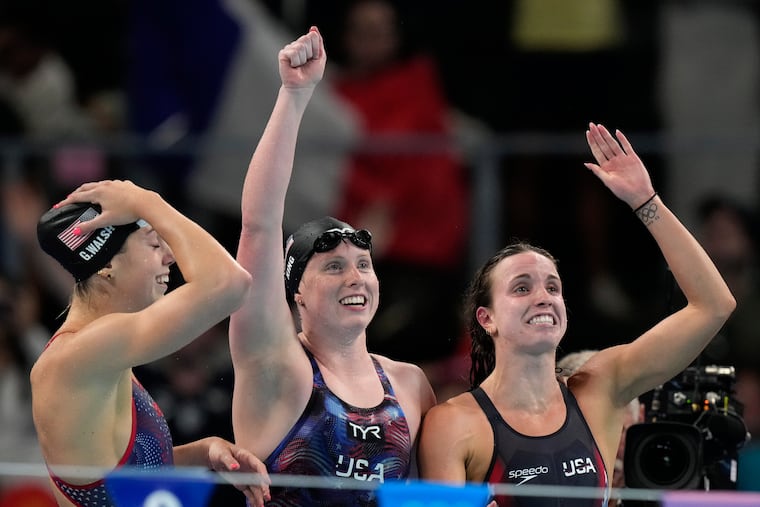 From left, the United States' Gretchen Walsh, Lilly King, and Regan Smith celebrate winning the gold medal in the women's 4x100-meter medley relay.