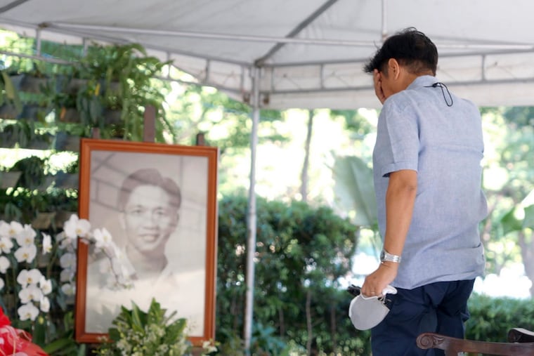 In this photo provided by the Office of Ferdinand Marcos Jr., Ferdinand "Bongbong" Marcos Jr. visits the tomb of his father at the National Heroes Cemetery in Metro Manila, Philippines.