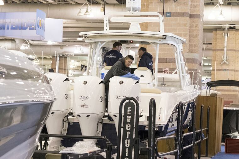 Fidek Garcia and co-workers from Stone Harbor Marina get a 36-foot Everglades yacht ready.