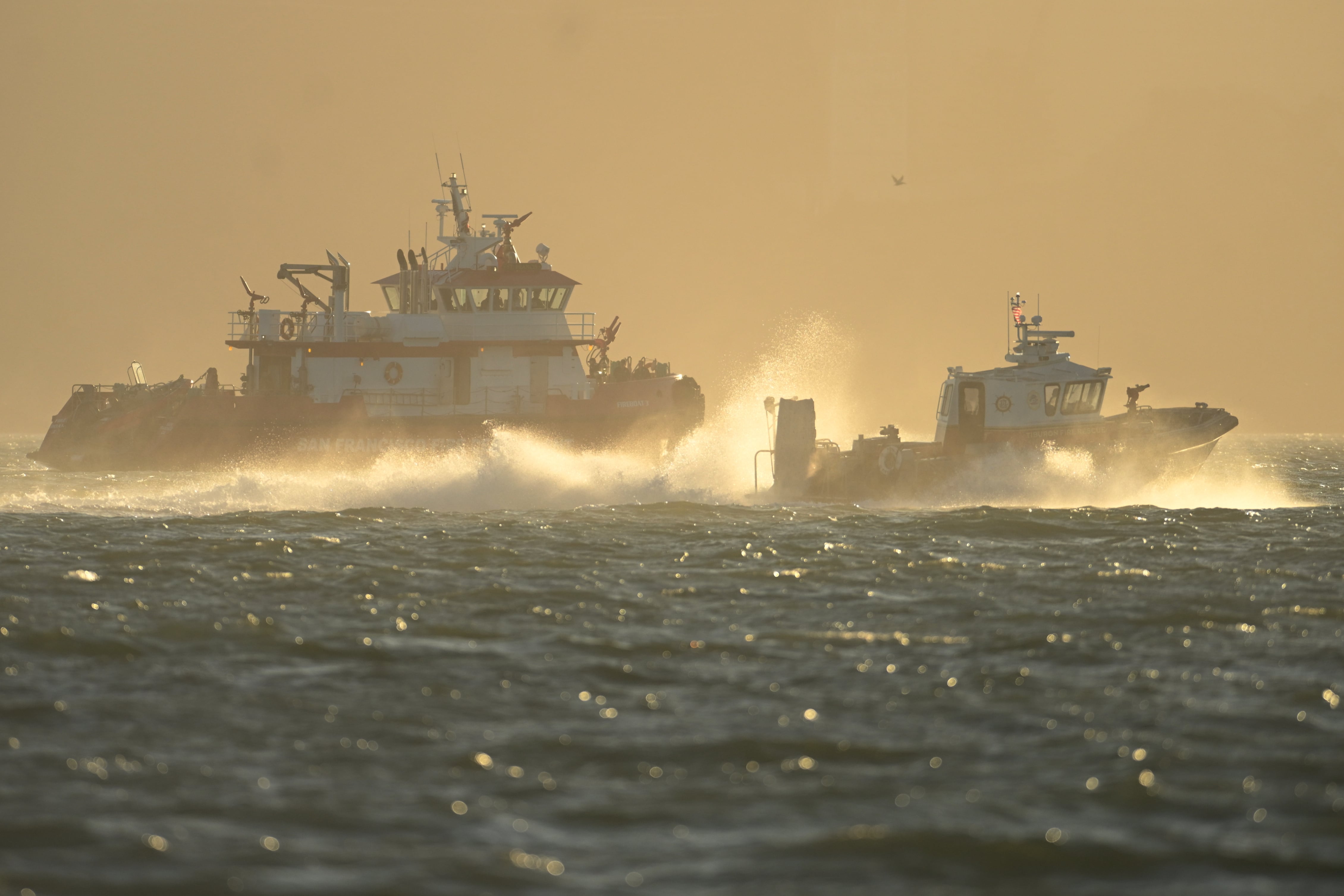Search and rescue operation for a sunken pontoon boat near Alcatraz Island, in photos