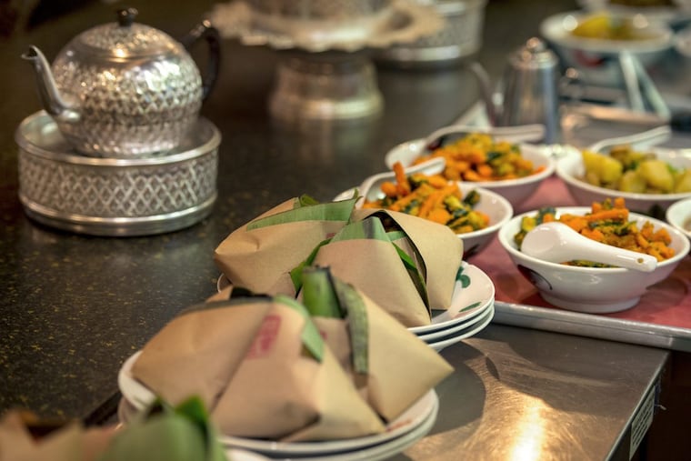 Food is ready to serve at a Sanctuary Supper dinner at Sate Kampar.