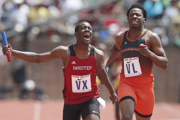 Kristian Marche, left, of Imhotep edges out Clifford Brinkley of Overbrook in the High School Boys' 4x400m Philadelphia Public League at the Penn Relays on April 29, 2017 at Franklin Field.