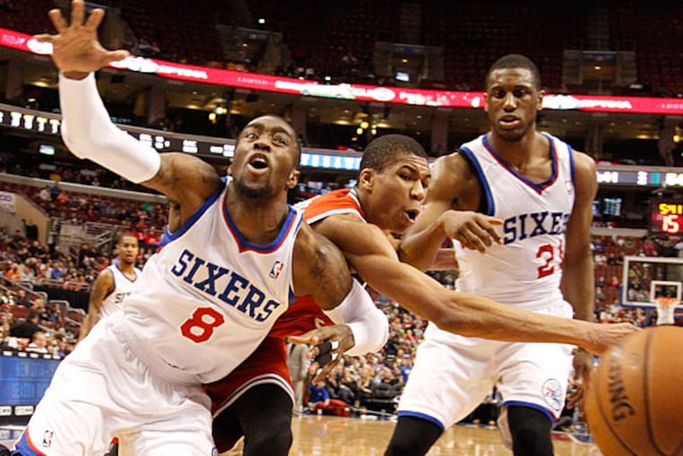 The Sixers' Tony Wroten has the ball knocked away by the Bucks' Giannis Antetokounmpo as Thaddeus Young watches in second quarter. (Ron Cortes/Staff Photographer)